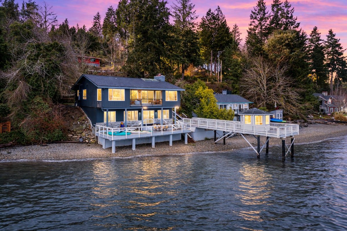 Waterfront house and dock gazebo at twilight