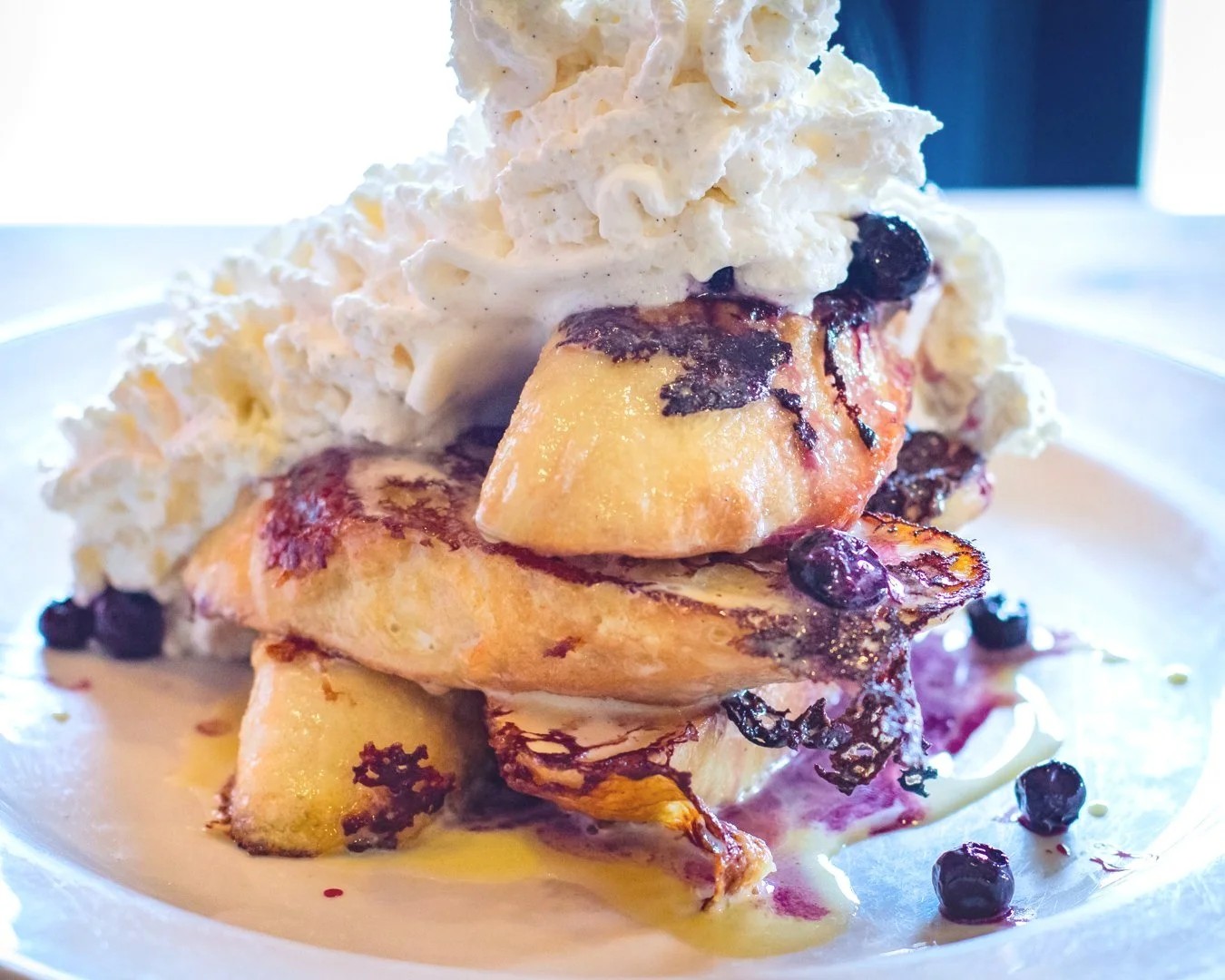 Lemon curd and blueberry French toast with whipped cream at NetShed No. 9