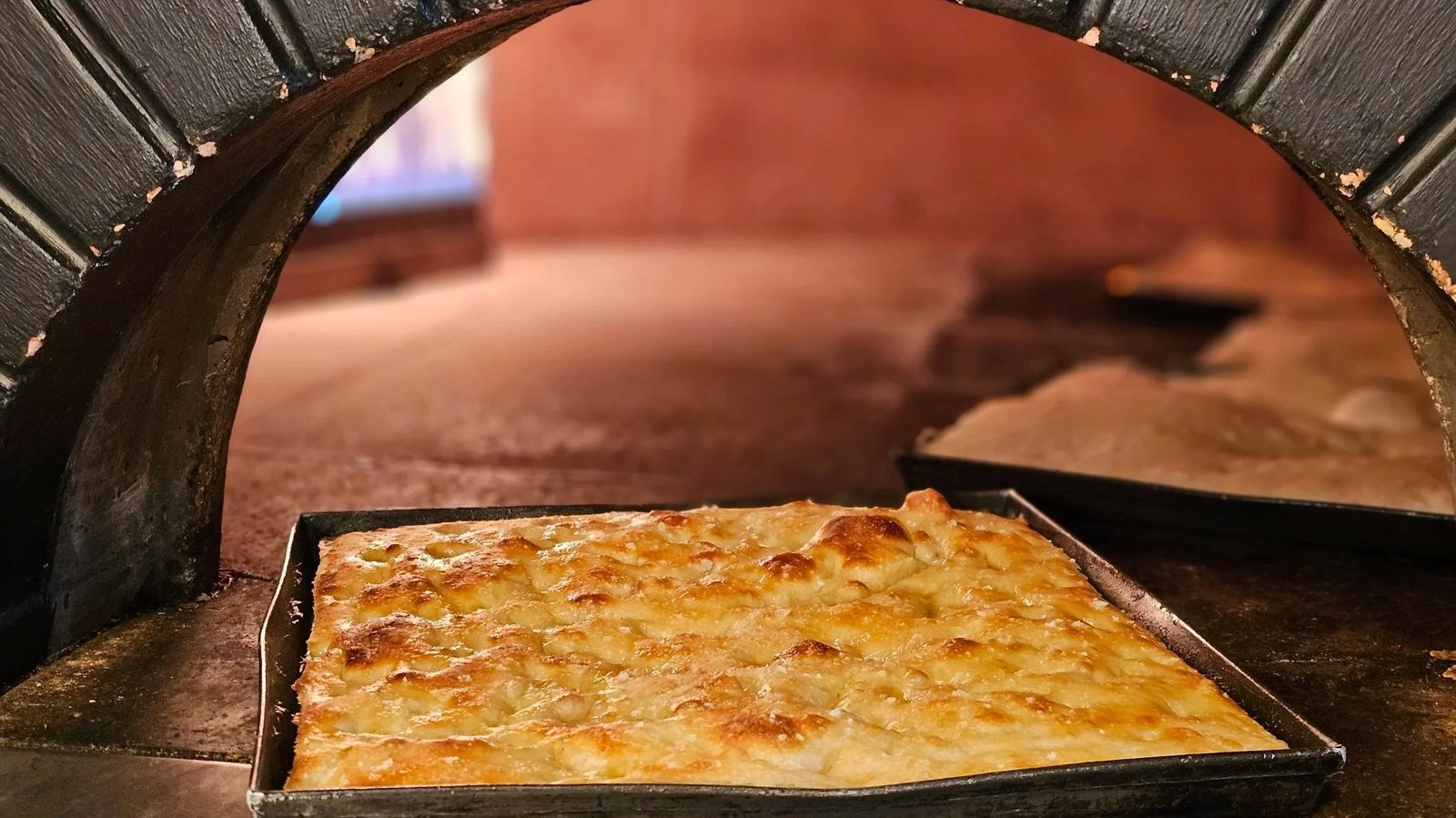 Sourdough focaccia coming out of the wood-fired oven at Olalla Bay Market
