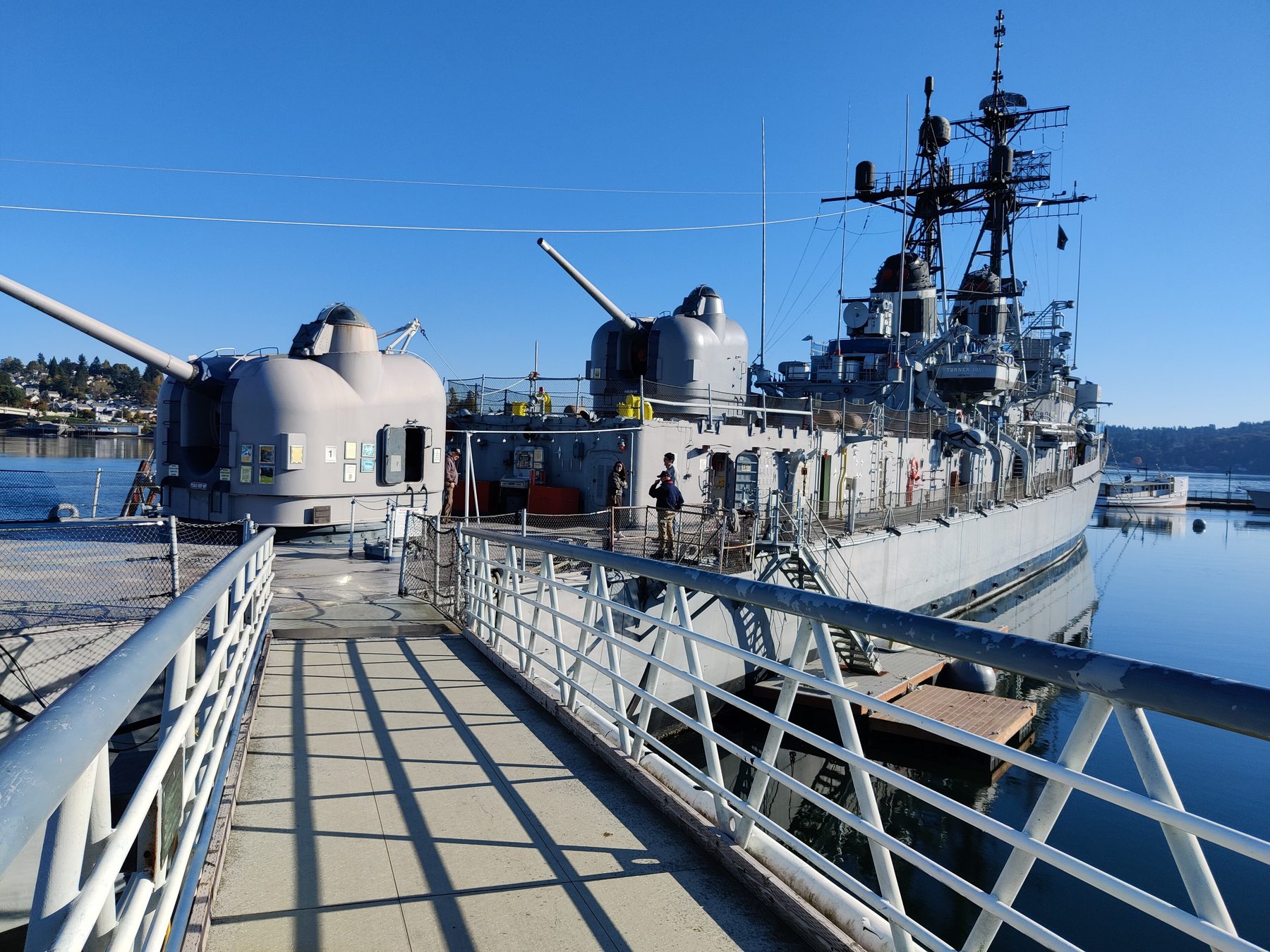 The gangway onto USS Turner Joy, moored on the Bremerton waterfront under a blue sky