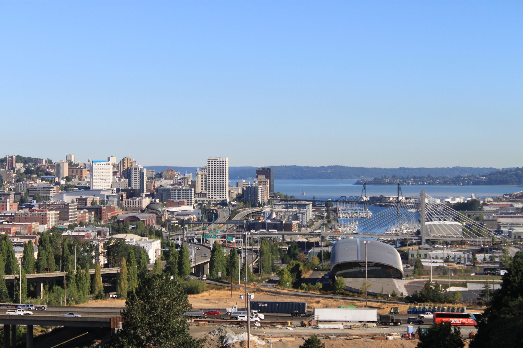 Downtown Tacoma and the Thea Foss Waterway seen from McKinley Way under a blue sky